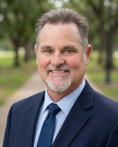 Studio-style AI headshot of the same customer, made with HeadshotPro